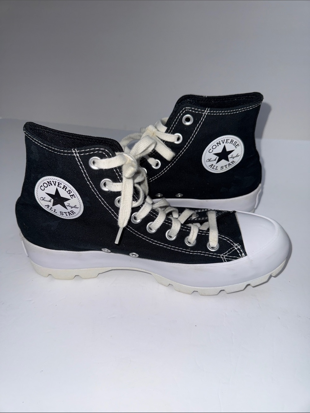 Converse women’s Black & White High-Top Chuck Taylor Sneakers